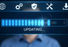 Security dealer and technician using alarm company management software on a tablet to track RMR and service schedules.