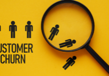 Close up of stick figures falling under a microscope while the words customer churn hold up three stick figures